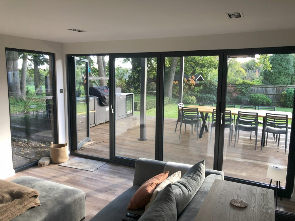 Interior of bespoke garden room in seer green featuring modern layout and high quality finishes scaled